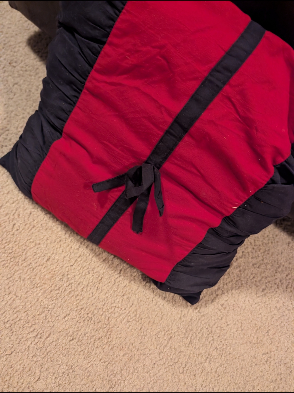 Red and Black Decorative Pillow with Tie Accent